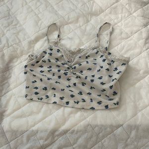 She in shirt with blue flowers and lace